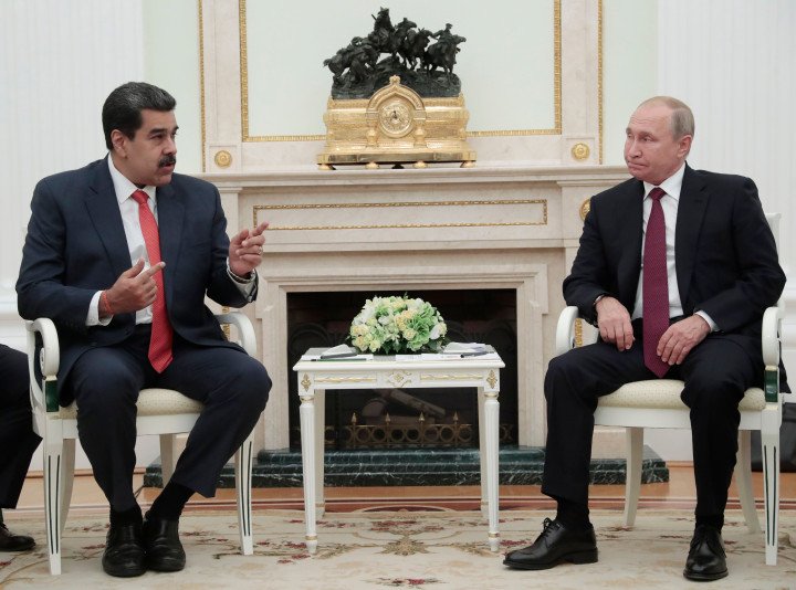 Russian President Vladimir Putin (R) speaks with Venezuelan President Nicolas Maduro during their meeting at the Kremlin in Moscow on September 25, 2019. (Photo credit should read SERGEI CHIRIKOV/AFP via Getty Images)