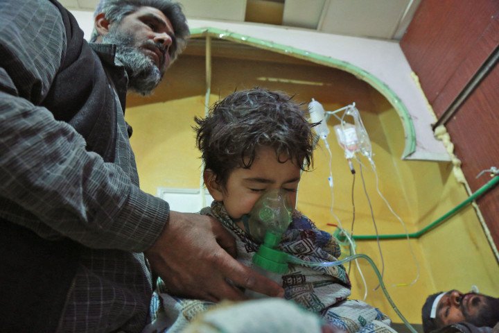 Syrian children and adults receive treatment for a suspected chemical attack at a makeshift clinic in Ghouta 2018 (Source: Hamza Al-Ajweh via Getty Images) Syrian children and adults receive treatment for a suspected chemical attack at a makeshift clinic in Ghouta 2018 (Source: Hamza Al-Ajweh via Getty Images)