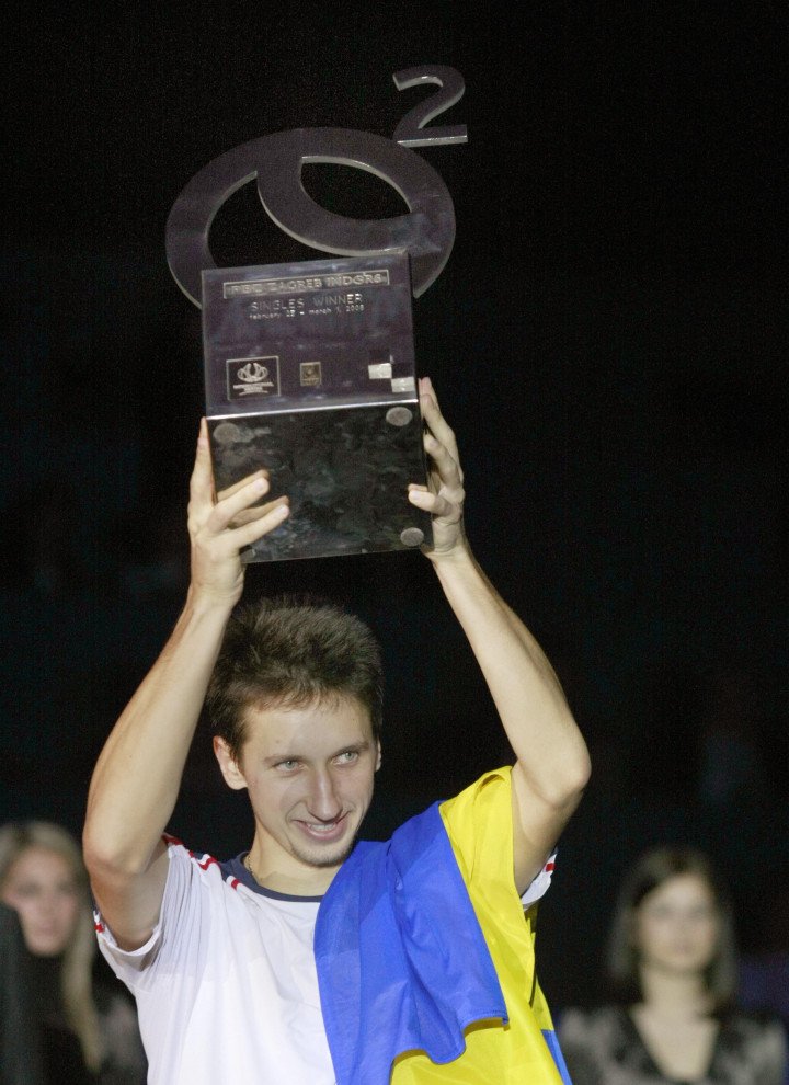 Sergiy Stakhovsky raises the winner trophy as he celebrates his victory against Ivan Ljubicic after their final match of the ATP Zagreb Indoors tennis tournament on March 01, 2008. Photo: HRVOJE POLAN/AFP via Getty Images.