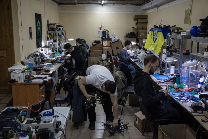 Workers assemble FPV drones in a drone production facility on April 5th, 2025, in northeastern Ukraine. (Photo: Getty Images)