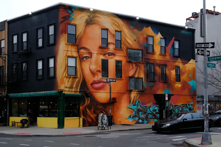 A new mural honoring murdered Ukrainian refugee Iryna Zarutska, partially funded by Elon Musk, appears on a building in Brooklyn. (Photo: Luiz C. Ribeiro for New York Post)