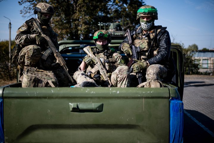 Ukrainian soldiers from the Liut Brigade ride in a pickup truck near the frontline city of Chasiv Yar in the Donetsk region, October 7, 2024. (Source: Getty Images)