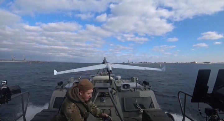A Russian serviceman prepares a fixed-wing drone for launch from a fast-moving boat during a test in coastal waters. (Source: ZALA) A Russian serviceman prepares a fixed-wing drone for launch from a fast-moving boat during a test in coastal waters. (Source: ZALA)