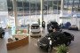 Visitors inspect a Toyota Hilux wagon, right, on display in the showroom of a Toyota Motor Corp. automobile dealership in Moscow, Russia, on November 19, 2014. (Source: Getty Images)
