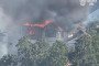A private home burns following a Russian attack on Ukraine’s Odesa region on August 17, 2026. The strike destroyed the building’s roof and damaged neighboring homes.