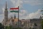 The national flag of Hungary waves from a pole with the historic Matthias Church and Fisherman's Bastion complex rising in the background. (Source: Getty Images)