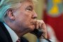 President Donald Trump talks during a telephone call in the Oval Office of the White House of the White House in Washington, DC on June 27, 2017. (Source: Getty Images)