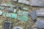 Recovered wreckage from the jet-powered Shahed drone, including broken carbon-fiber casing pieces and internal electronic circuit boards, laid out on the grass. (Source: Serhii “Flash” Beskrestnov)
