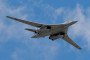 A Russian Tu-160 strategic bomber flies over the Kremlin during a military parade rehearsal in Moscow.  (Source: Getty Images)