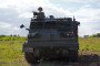 A soldier operates an armored vehicle during military training in Estonia. (Source: Getty Images)