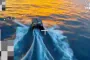 A Russian “Skorlupa” uncrewed surface vessel launches a fiber-optic FPV drone during Black Sea testing. (Source: Defense Express)