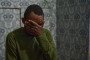 A captured prisoner of war (POW) from Zimbabwe covers his face in deep regret during an interview detailing how he was deceived into joining the Russian military.