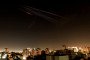 Illustrative image. This long-exposure photograph shows rocket trails in the sky above the Israeli coastal city of Netanya amid a fresh Iranian missile barrage early on March 18, 2026. (Source: Getty Images)