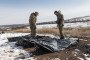 Ukrainian volunteers recover the bodies of Russian soldiers in Donetsk region for identification and repatriation, March 2, 2025. (Source: Getty Images)