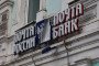 A damaged signboard on a building in Russia. (Source: Getty Images)