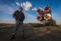 Russian soldier stands guard as a Soyuz rocket is rolled out for launch at Baikonur Cosmodrome, Kazakhstan, September 23, 2014. Illustrative photo. (Source: Getty Images)