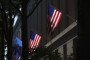 American flags hang on the side of the Robert F. Kennedy Department of Justice Building. (Source: Getty Images)