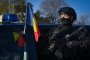 A female member of the Romanian Intelligence Service (SRI) takes part in a military parade on the National Day of Romania in Bucharest on December 1, 2021.