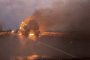 A logistics vehicle burns on a highway following a Russian drone strike; one of dozens of attacks targeting supply routes on January 30 using Starlink-connected drones. (Source: Serhii Flash)