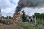 Smoke rises from a house set ablaze following a Russian guided aerial bomb strike on the village of Slatyne in Ukraine's Kharkiv region on July 14. (Source: Derhachi City Military Administration)