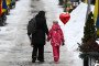 A mother and her daughter walk holding a heart ballon on Valentine's Day at the Lychakiv Military Cemetery in Lviv, on February 14, 2026. Illustrative photo. (Source: Getty Images)
