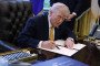 US President Donald Trump signs a document during a White House signing ceremony in the Oval Office of the White House on March 16, 2026 in Washington, DC. (Source: Getty Images)