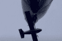 A strike drone hangs beneath a high-altitude tethered aerostat before being released. (Source: Under Fire News)