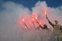 Servicemen of Ukrainian Azov Brigade burn flares during a memorial event at Independence Square