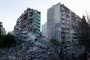 Rescuers work near damaged residential buildings following a large-scale Russian drone and missile attack on Kyiv, Ukraine, May 14, 2026. (Source: Getty Images)