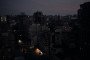 A general view of buildings and streets unlit before dawn during an overnight power outage following a Russian attack on energy infrastructure the previous evening. (Source: Getty Images)