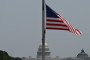 The US Capitol is seen from the National Mall, with flags at half-staff in honor of US Senator Lindsey Graham, who passed away on Saturday, July 11, in Washington, DC, on July 15, 2026.