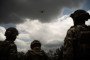 Ukrainian soldiers from the "Black Sky" battalion of the Spartan brigade look at a drone transformed into a front-line delivery cargo on June 14, 2025. (