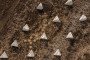 Barbed wire, dragon’s teeth anti-tank obstacles, and mines are seen along a fortification line on March 13, 2025, in the Kharkiv region, Ukraine.