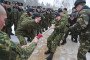 Belarus interior troops encourage their team as they compete in a tug of war during a sport competition near the village of Okolitsa, some 30 km north fo the capital Minsk, on March 5, 2011. Illustrative photo. (Source: Getty Images)