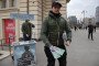 An man holds promotional materials of Russian Defense Ministry, campaigning to sign up for contract service. (Source: Getty Images)