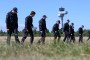 Police officers are searching a field at Leipzig/Halle Airport for evidence, following the drone incident on August 5. (Source: Getty Images)