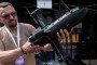 A man examines a Ukrainian-made P1-Sun interceptor drone during the career festival on May 21, 2026 in Kyiv, Ukraine. (Source: Getty Images)