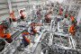 Robots produce automotive body sheet metal products in the production workshop of a mold stamping company in Fuzhou, Fujian Province, China, on April 16, 2026. Illustrative image. (Source: Getty Images)
