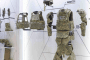 Illustrative photo of Russian military protective equipment, including ballistic helmets, body armor, gloves, boots, and modular combat gear, displayed at a defense industry exhibition. (Photo: open source)
