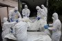 Forensic scientists unloaded from a truck onto a stretcher with bodies of fallen Ukrainian soldiers repatriated as part of the 6000 for 6000 exchange on June 26 2025, in Kyiv, Ukraine. (Source: Getty Images)