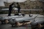 Operators of Ukraine’s Military Intelligence (HUR) prepare long-range strike drones and munitions at an undisclosed location. (Source: HUR)