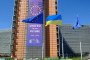 EU and Ukrainian flags fly in the wind in front of the Berlaymont, the EU Commission headquarter for the independance day of Ukraine, on August 24, 2025 in Brussels, Belgium. (Source: Getty Images)