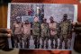 Family member in Nairobi holds a photo of Kenyan men recruited into the Russian military after being lured with job offers. Illustrative photo. (Source: Getty Images)