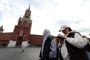 A woman attempts to access the internet using his smartphone while walking near the Kremlin, on March 31, 2026, in Moscow, Russia. (Source: Getty Images)
