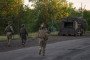 Servicemen of the Armed Forces of Ukraine secure a frontline road after detecting a Russian FPV drone in the Donetsk region on May 27, 2026, in Donetsk, Ukraine.