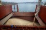 Grain is loaded into a ship's cargo hold at a port terminal. (Source: Getty Images)