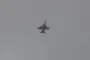 An Iranian Air Force fighter jet flies over Tehran during reported aerial patrols. (Source: Babak Taghvaee)