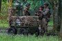 Ukrainian servicemen stand next to an unmanned ground vehicle on May 17, 2026 in Druzhkivka, Donetsk Oblast, Ukraine. (Source: Getty Images)