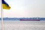 Ukrainian flag waves near cargo ship in Black Sea. (Source: Getty Images)