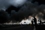 Black smoke rises from the refinery where a fire broke out following a strike as firefighting efforts continue in Moscow, Russia, on June 18, 2026. (Source: Getty Images)